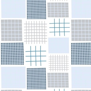 Blue tone geometric square quilt pattern.