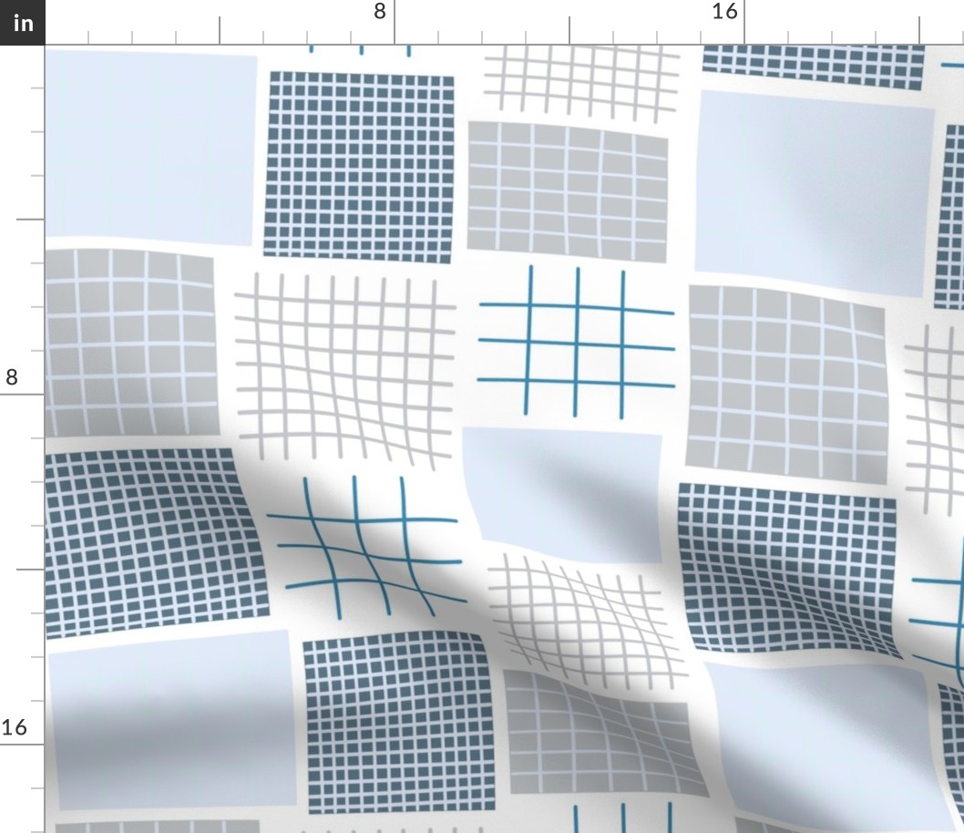 Blue tone geometric square quilt pattern.