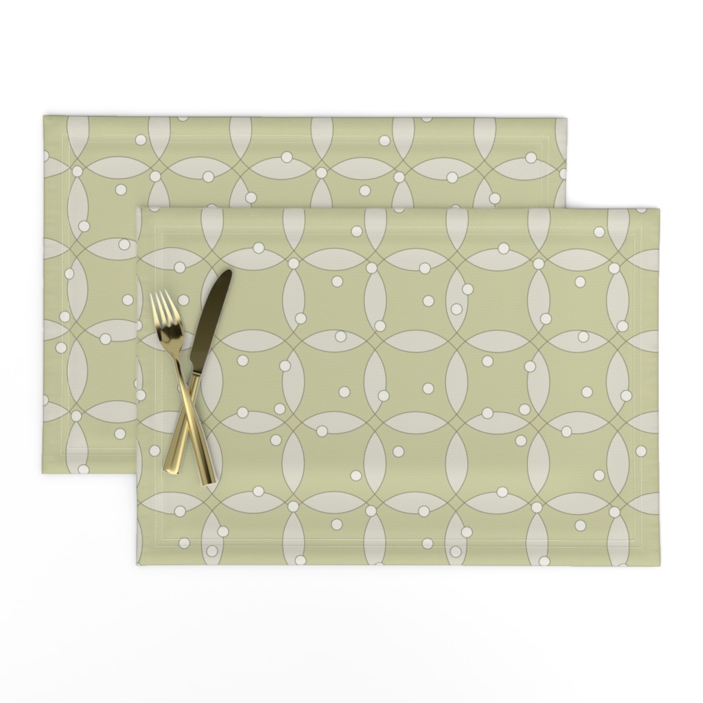 overlapping rings in beige with white dots on light olive green