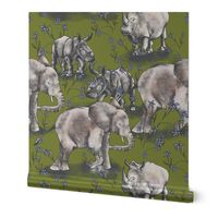 Baby elephants and Rhinos on a walk with green turf