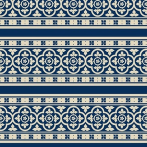 medieval-style quatrefoil borders, ivory on dark blue