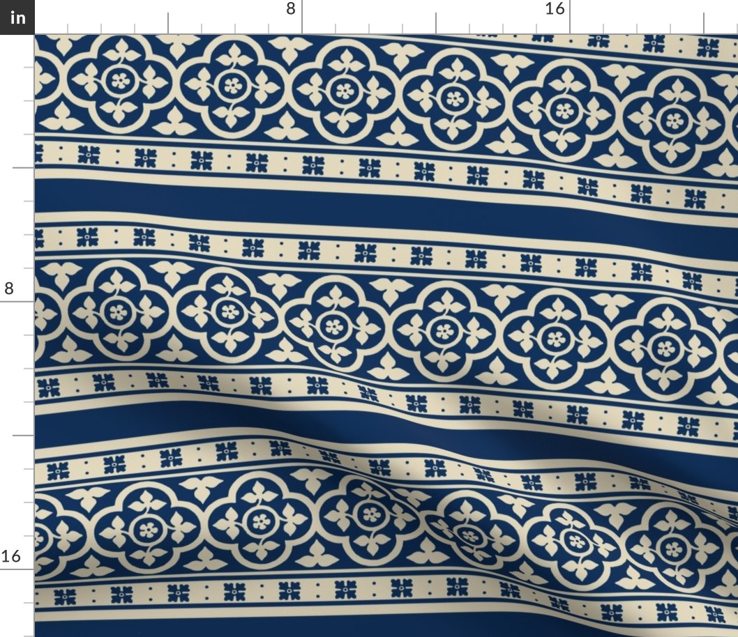 medieval-style quatrefoil borders, ivory on dark blue