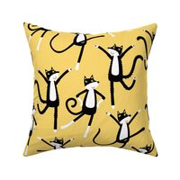 Dancing Black and White Tuxedo Cats Yellow