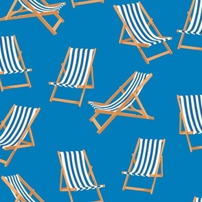 Blue Striped Deck Chairs on Cyan Blue Background