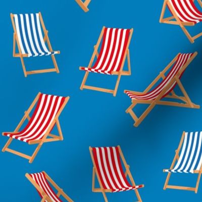 Red and Blue Striped Deck Chairs on Cyan Blue Background