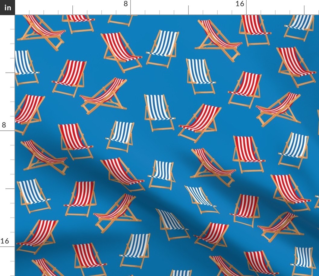 Red and Blue Striped Deck Chairs on Cyan Blue Background