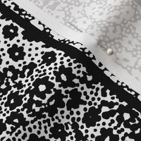 large scattered floral stripes in black and white