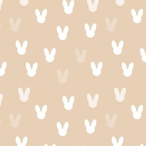 Little boho minimalist bunny design for easter and springtime abstract animal shapes for nursery and kids white on beige