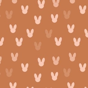 Little boho minimalist bunny design for easter and springtime abstract animal shapes for nursery and kids blush on burnt orange 