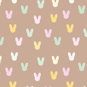 Little boho minimalist bunny design for easter and springtime abstract animal shapes for nursery and kids spring palette on latte beige