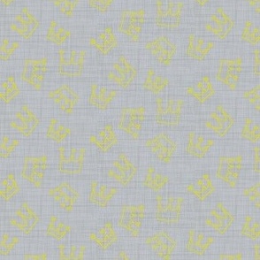 yellow crown on gray linen texture