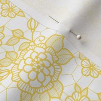 Gold lace flower on white