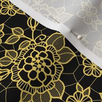 Gold lace flower on black