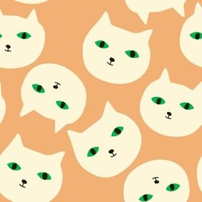 Cute white cat's heads with green eyes repeated on peach background . Simple and stylish minimalistic print.