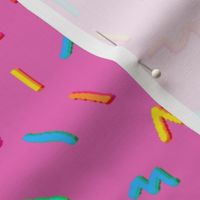 Pixelated colorful confetti with pink background
