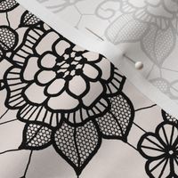 Black lace flower on cream 