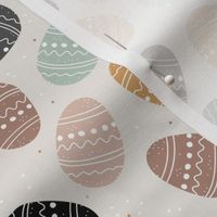 Little Easter eggs boho spring design vintage earthy tones brown black beige sage green and ochre boys palette