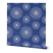 White Mandalas and snow on a denim blue background - large scale