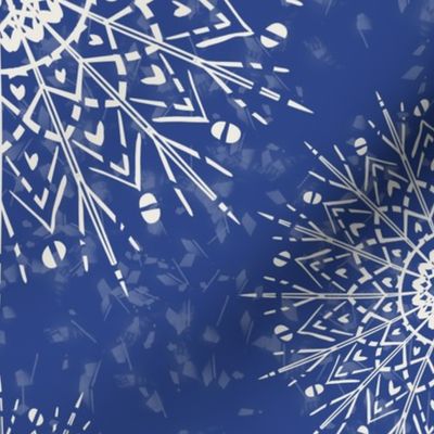 White Mandalas and snow on a denim blue background - large scale