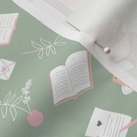 I love books cozy home reading and journaling notebooks and letters flower vase and glasses  nerd design pink orange blush on sage green