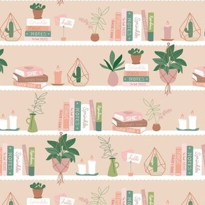 Sweet Scandinavian interior bookcase with plants and candles green neutral blush on cream  