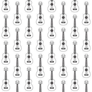 tiny black and white ukuleles