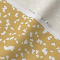 Gritty spots and speckles sweet boho style minimalist animal print texture  baby nursery print white on ochre yellow
