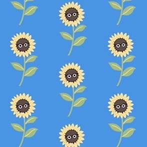 Fluffy sunflowers with glasses on blue