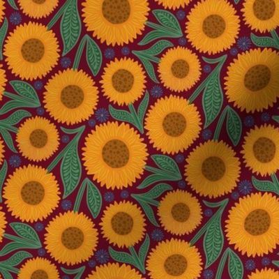 Small sunflowers on burgundy red
