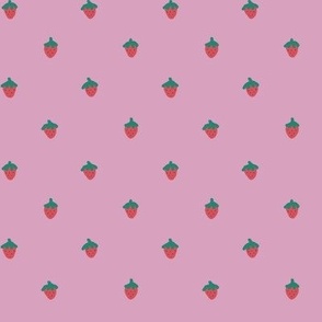 Mini strawberries on pink