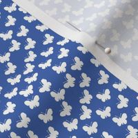 White butterflies on royal blue (mini)