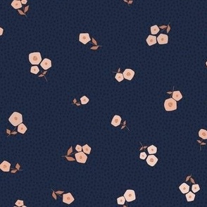 Traditional sweet ditsy floral in soft pink, peach, and tan on navy blue background