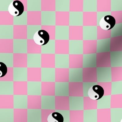 Retro check and Yin Yang black and white vintage Chinese balance yoga symbol on mint green pink