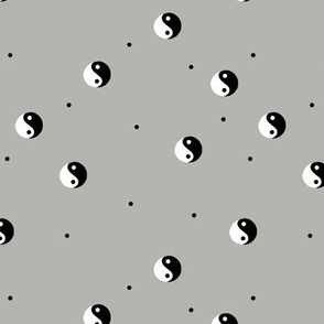 Retro Yin Yang black and white vintage Chinese balance yoga symbol and spots on slate gray 