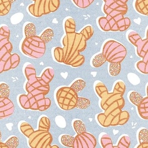 Small scale // Hippity hoppity Easter Mexican bunny conchas on it’s way! // pastel blue background pink and yellow pan dulce 