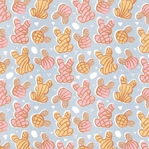 Tiny scale // Hippity hoppity Easter Mexican bunny conchas on it’s way! // pastel blue background pink and yellow pan dulce 