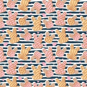 Tiny scale // Hippity hoppity Easter Mexican bunny conchas on it’s way! // nile blue stripes background pink and yellow pan dulce 