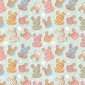 Tiny scale // Hippity hoppity Easter Mexican bunny conchas on it’s way! // aqua background multicoloured pan dulce