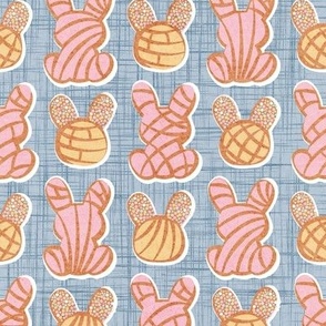 Small scale // Hoppy Easter // pastel blue linen texture background pink and yellow Mexican pan dulce bunny conchas