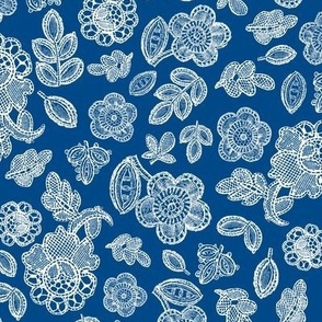 Lace flowers and leaves white on blue 