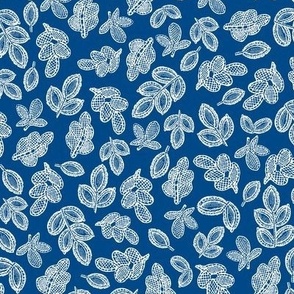 Small lace leaves white on blue