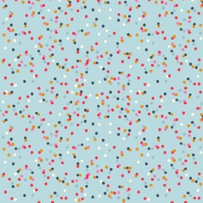 Colorful round confetti on blue. Cute polka dots