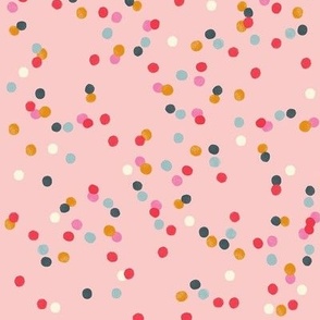 Colorful round confetti on pink. Cute polka dots