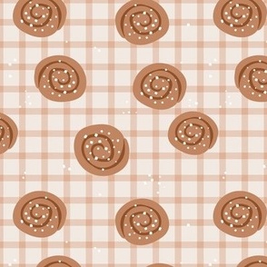 Snack time - cinnamon bun Swedish bakery picnic lunch with sugar sprinkles on plaid soft blush