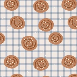 Snack time - cinnamon bun Swedish bakery picnic lunch with sugar sprinkles on plaid moody blue beige