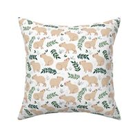 Wild animals - sweet capybara friends and lush jungle leaves green beige sand on white