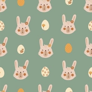 Cute rabbit faces on green