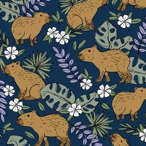 Wild animals - freehand sketch capybara jungle friends with monstera leaves and tropical hibiscus flowers caramel brown olive green eucalyptus on navy blue