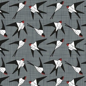 Small scale // Geometric spring swallows // green grey linen texture background black and white birds neon red beak