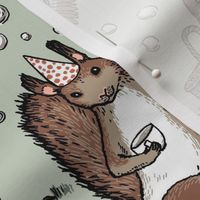 Woodland party - happy woodland animals, cake, gifts, bubbles - on sage green